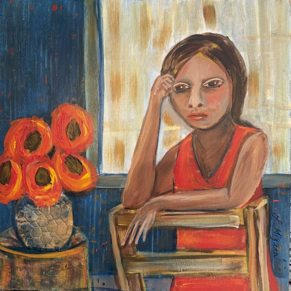 A woman in a red dress sits on a chair beside a vase of red flowers.