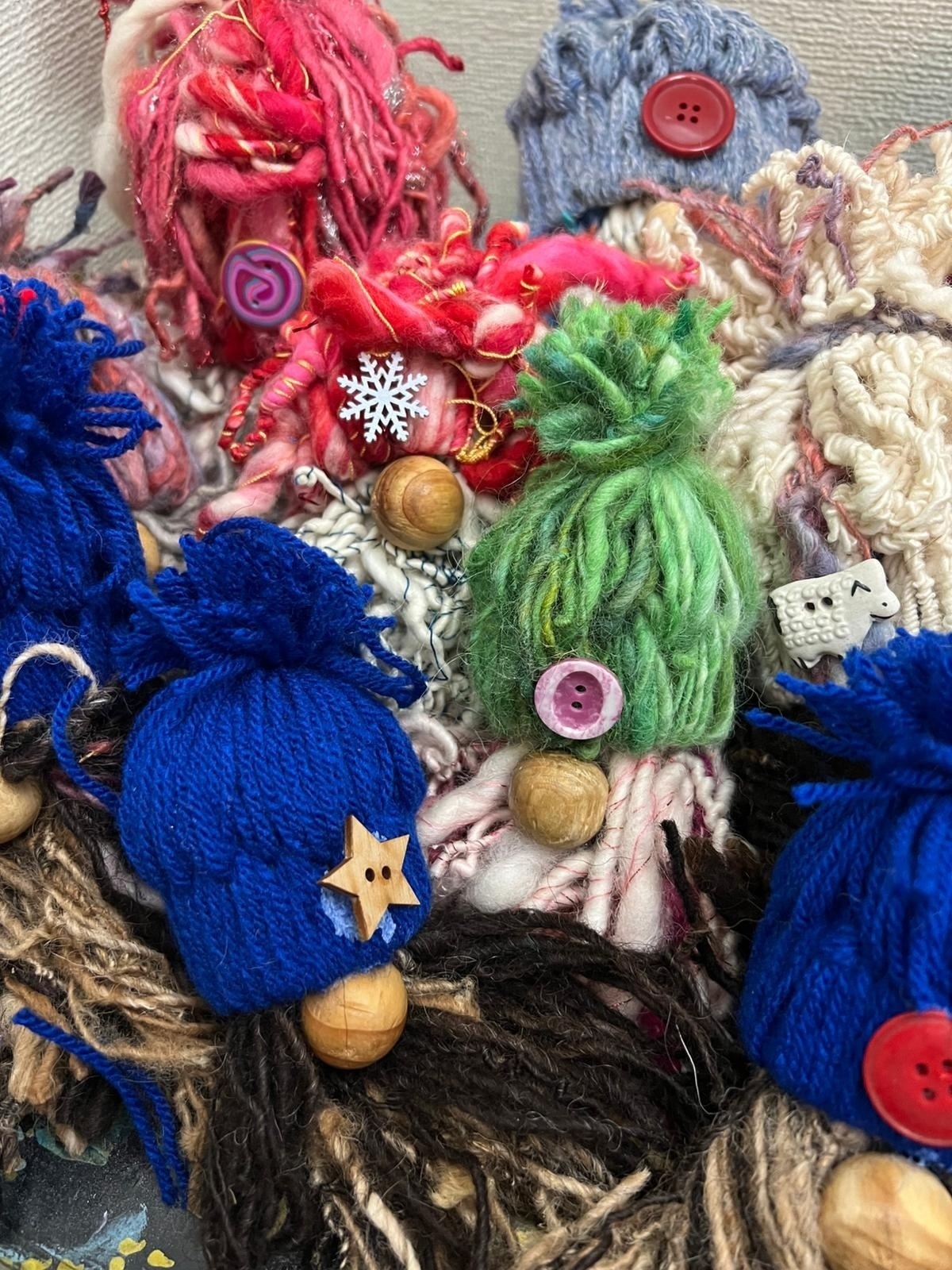 A photograph of a pile of handmade gnomes